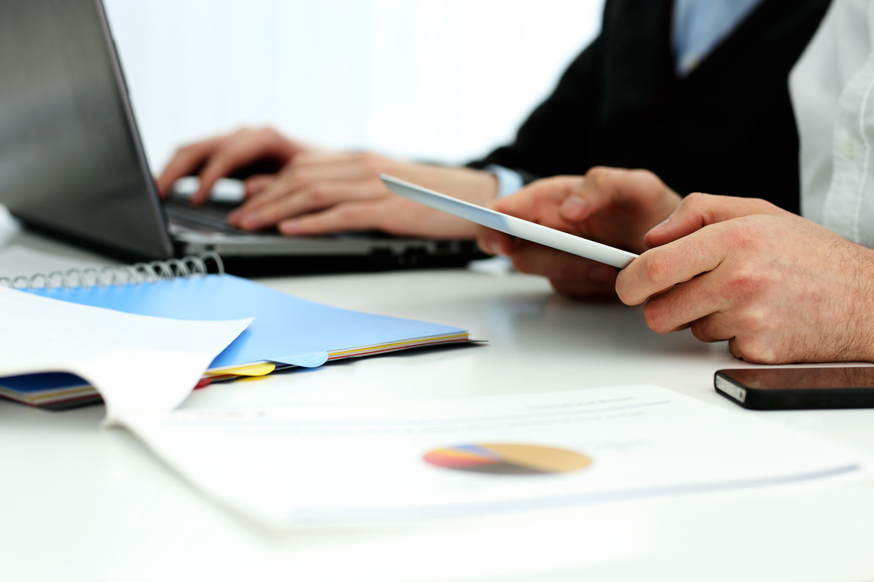 Businesspeople working in office at the table